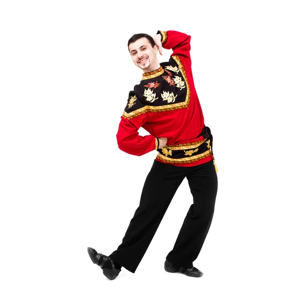 Attractive man wearing a folk russian costume dancing — Stock Photo, Image