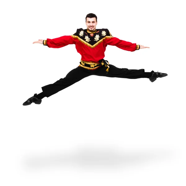 Young dancer man wearing a folk russian costume jumping — Stock Photo, Image