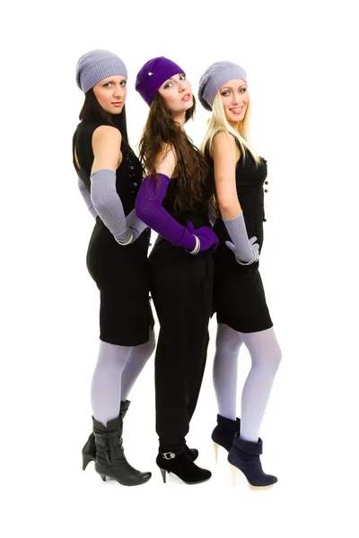 Drei Frauen mit weißer Strickmütze und Fäustlingen — Stockfoto