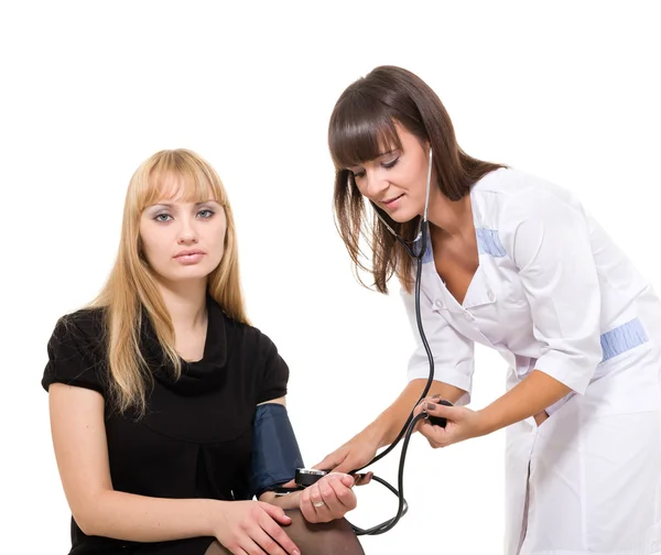 Medical doctor measuring blood pressure of patient — Stock Photo, Image