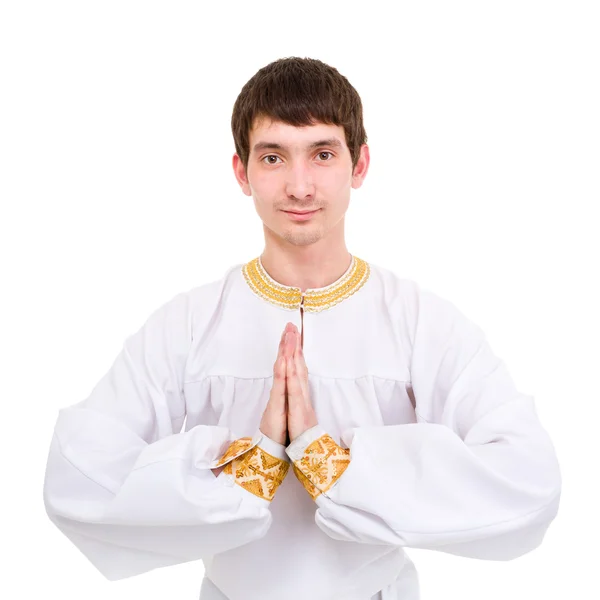 Namaste. bidden man op een blauwe achtergrond. — Stockfoto