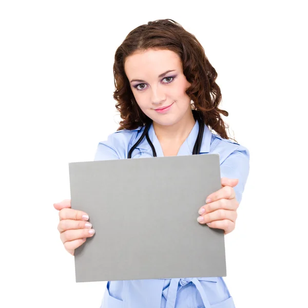 Medical doctor holding blank clipboard — Stock Photo, Image