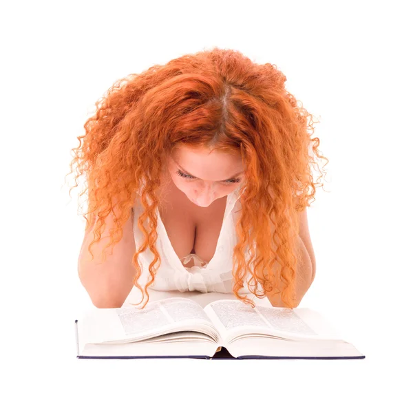Young attractive woman with the book lying — Stock Photo, Image