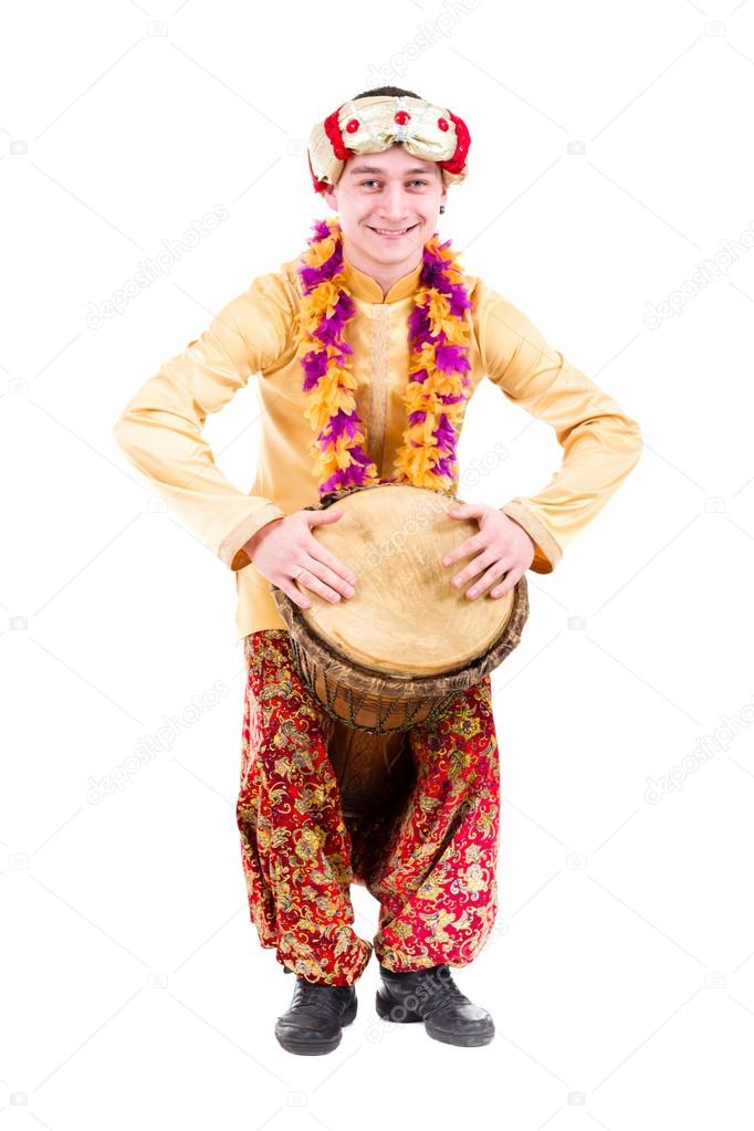 Full length portrait of indian man with a drum