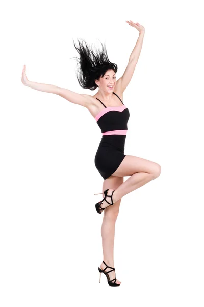 Vrouw in kleine zwarte jurk springen op wit — Stockfoto