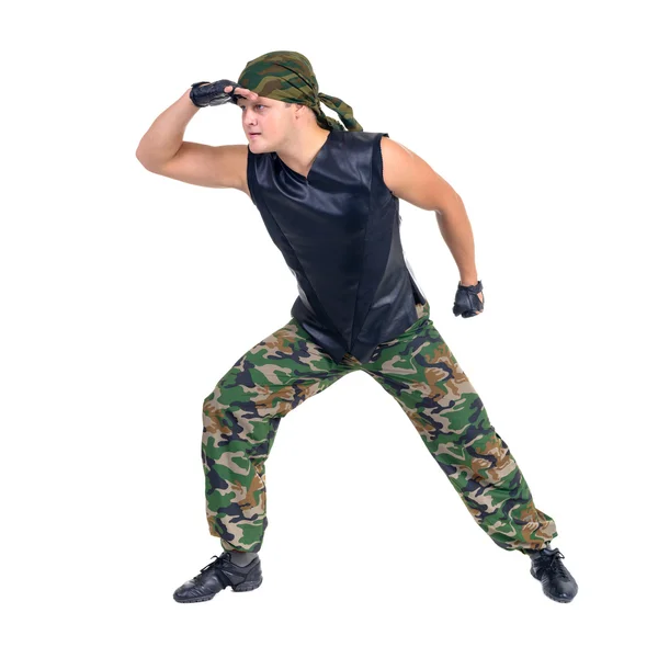 Soldatercamouflage danser viser nogle bevægelser - Stock-foto