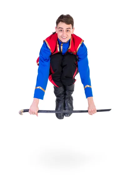 Russian cossack dance. Young dancer jumping over a sword — Stock Photo, Image