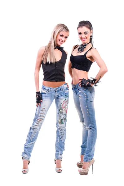 Two young sexy women in denim jeans isolated on white — Stock Photo, Image