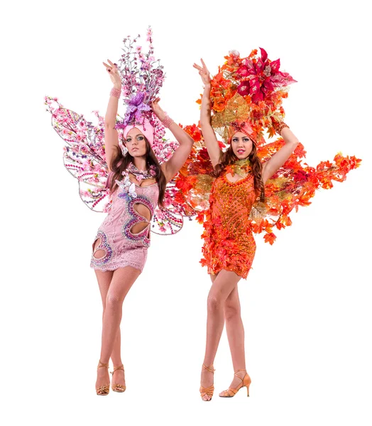 Two carnival dancer women dancing against isolated white — Stock Photo, Image