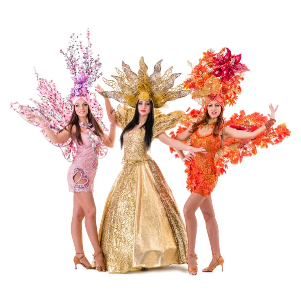 Three carnival dancer women dancing against isolated white — Stock Photo, Image