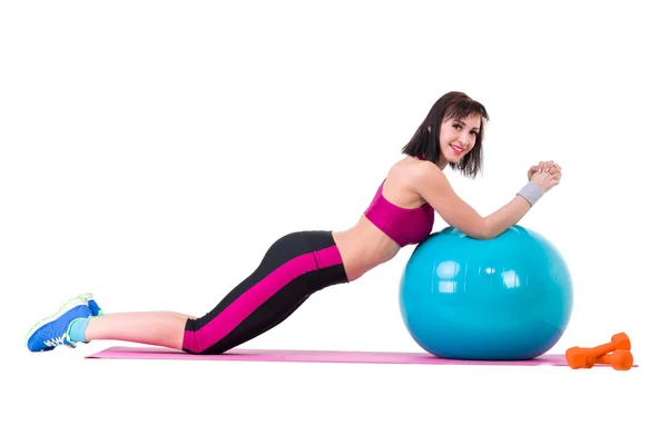 Young smiling woman makes exercise with fitball — Stock Photo, Image