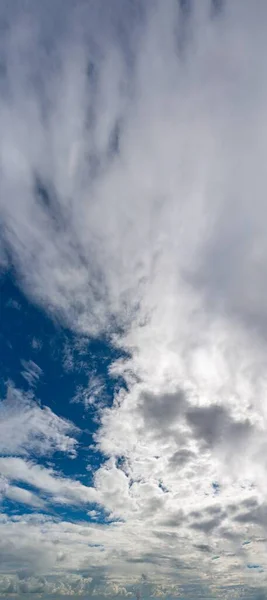 Fantastic clouds at sunrise, vertical panorama — Stock Photo, Image