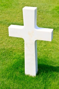 Marble Cross of fallen Soldier, American War Cemetery near Omaha clipart