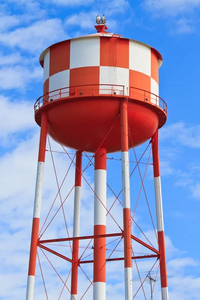 Water tower with red and white stripes — Stock Photo, Image