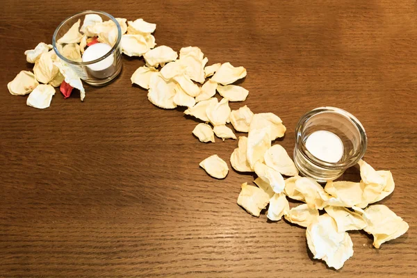 Spa still life with candle and rose petals — Stock Photo, Image