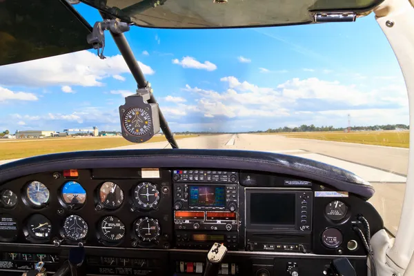 Cockpit view from small aircraft taking off from runway — Stock Photo, Image