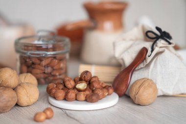 Peeled hazelnuts on the background of the kitchen table.
