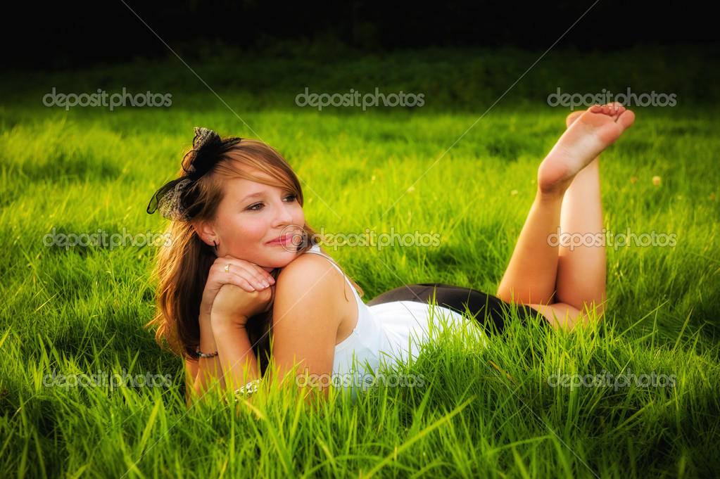Erotic woman lying in grass wallpapers