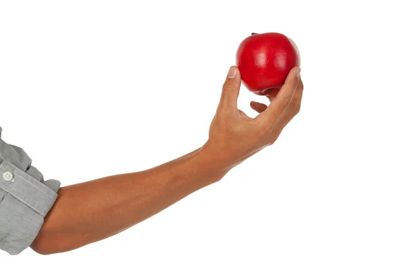 Arm med hand som håller ett äpple Stockfoto