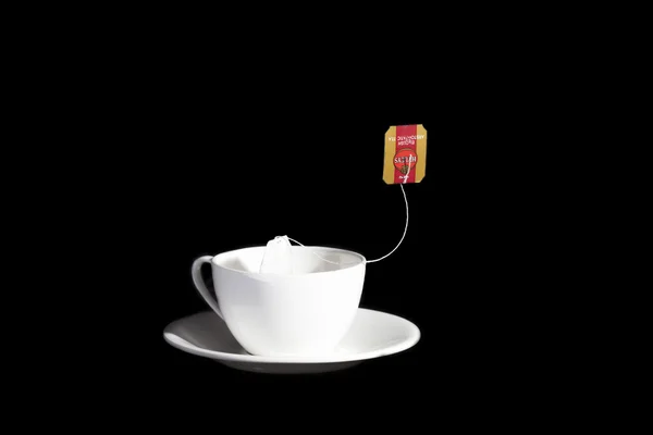 White cup on a black background — Stock Photo, Image