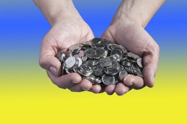 Coins in hand clipart