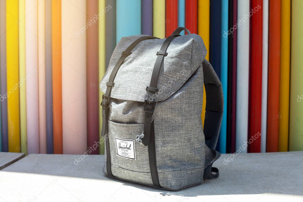PARIS, FRANCE - June 17, 2022: Herschel backpack vintage style stands on the street