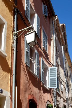 Hyres, France - August 10, 2022: Window with shutters. Typical architecture of a mediterranean city