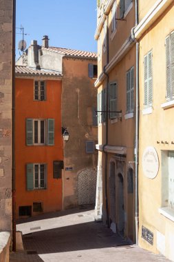 Hyres, France - August 10, 2022: Narrow ancient street. Typical architecture of a mediterranean city