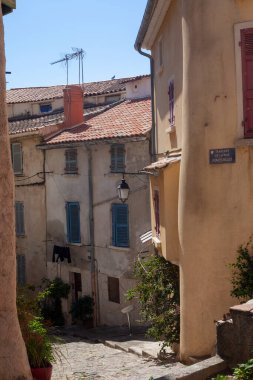 Hyres, France - August 10, 2022: Narrow ancient street. Typical architecture of a mediterranean city