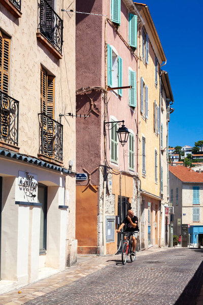 Hyres, France - August 10, 2022: Narrow street with yellow houses. Mediterranean style city. Cote d'Azur
