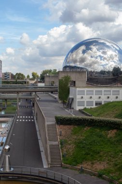 Paris, France - August 24, 2022: Lovelett Parisian park. Glass ball reflecting the blue sky