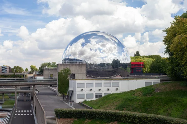 Paris, France - August 24, 2022: Lovelett Parisian park. Glass ball reflecting the blue sky