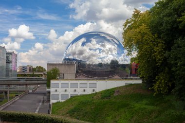 Paris, France - August 24, 2022: Lovelett Parisian park. Glass ball reflecting the blue sky