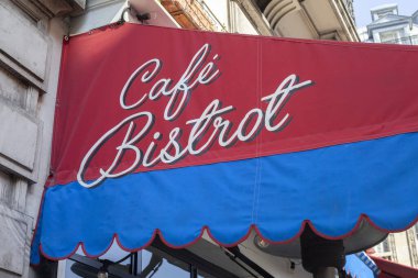 PARIS, FRANCE - AUGUST 31, 2022: Signboard of Cafe Bistro in French. Blue and red color