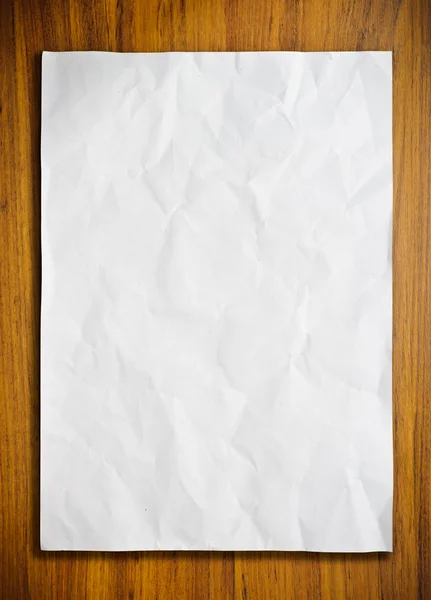 Белая бумага на деревянном полу — стоковое фото