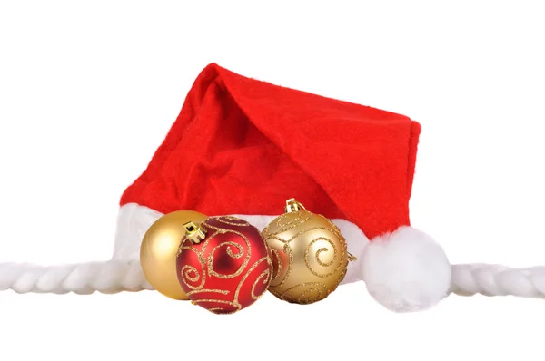 Santa hat with christmas balls — Stock Photo, Image