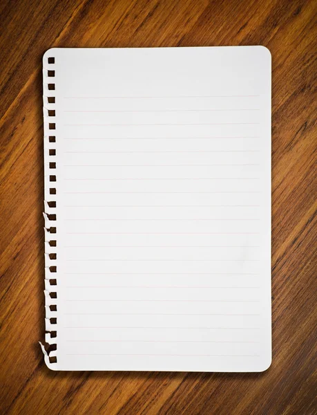 Notebook paper on wood floor — Stock Photo, Image