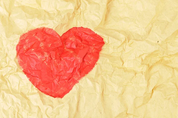 Heart shape on crumpled paper — Stock Photo, Image