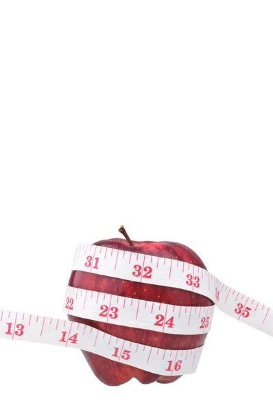 Red apple and measure tape — Stock Photo, Image