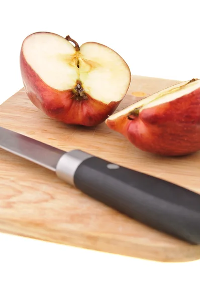 Red apple on chopping board — Stock Photo, Image