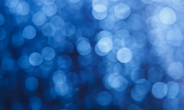 Blauer Bokeh-Hintergrund Stockbild