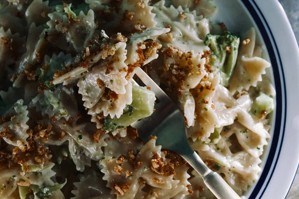 Creamy Italian alfredo bowtie pasta with broccoli