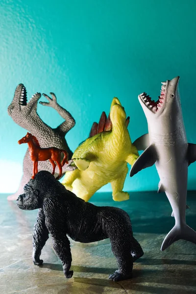 Toy Dinosaurs Shark Bullying Laughing Poor Sad Gorilla — Zdjęcie stockowe