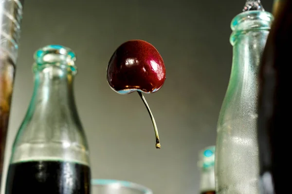 Cherry Floats Air Balloon Surrounded Cola Bottles — Foto Stock