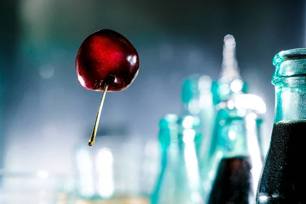 Cherry Floats Air Balloon Surrounded Cola Bottles — Stock Photo, Image