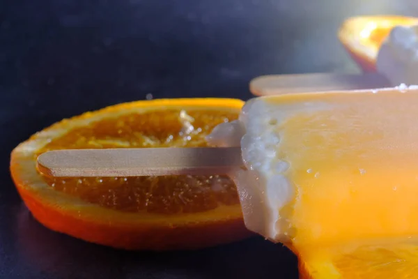 Oranges Cream Vanilla Ice Pops Melting Kitchen Counter — стоковое фото