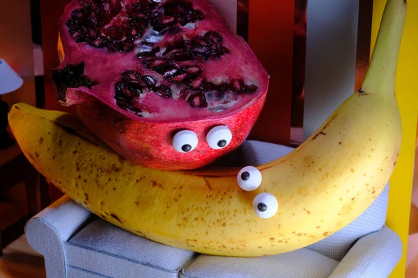 Anthropomorphic Pomegranate Banana Having Intimate Experience Couch — стоковое фото