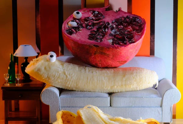 Anthropomorphic Pomegranate Banana Having Intimate Experience Couch — стоковое фото