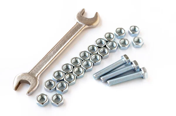Wrench on nuts and bolts — Stock Photo, Image
