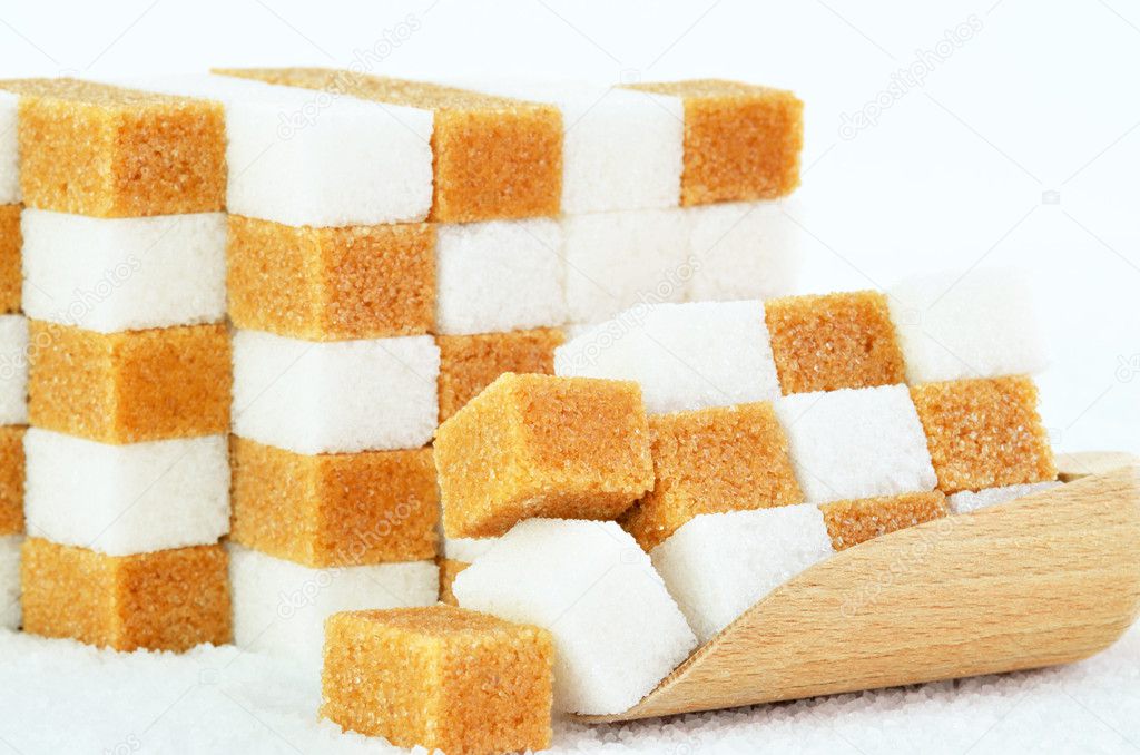 Piles of brown and white sugar cubes